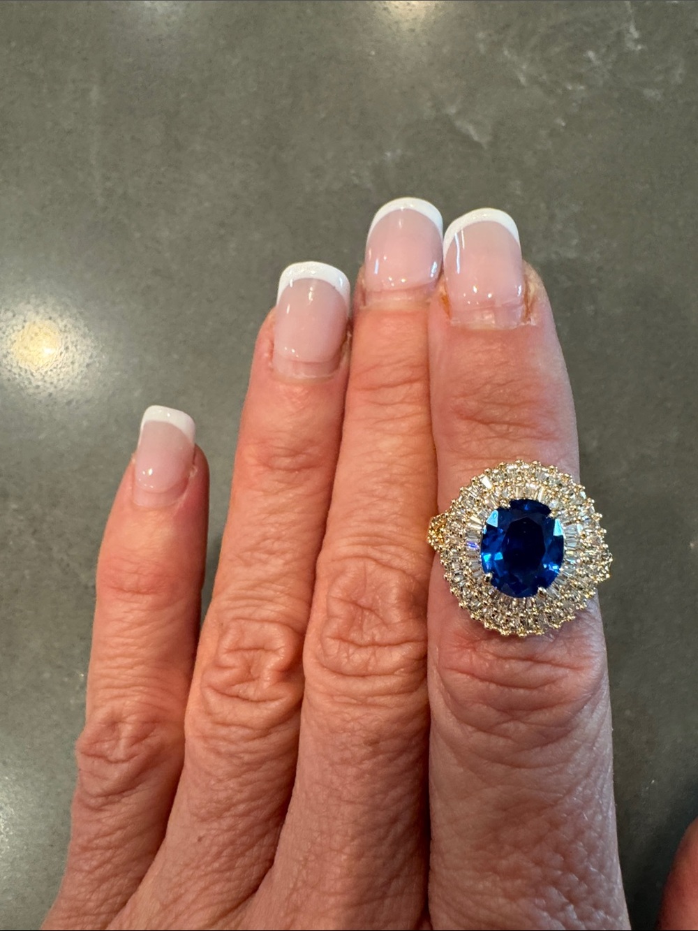 BP Gold Cocktail Ring with Deep Blue Center Stone and Halo Diamonds